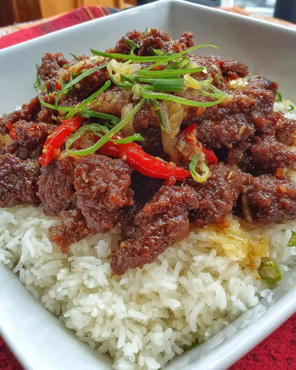 Air fryer crispy chilli beef served with fresh vegetables