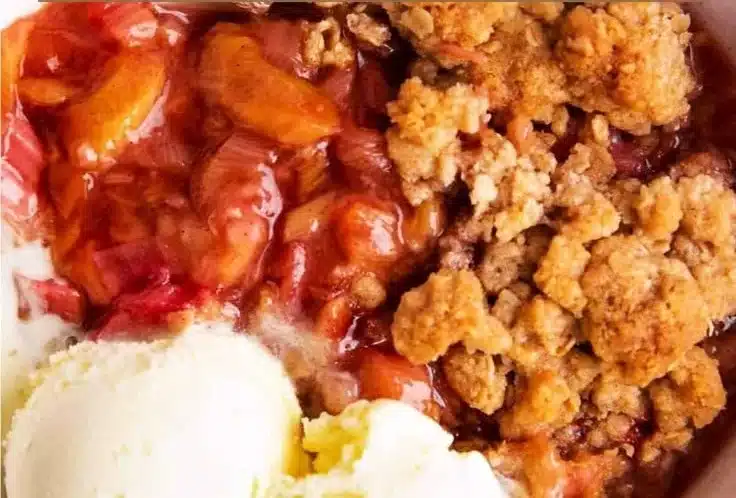 Delicious easy rhubarb crisp served in a bowl with a scoop of ice cream