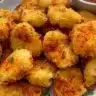 Plate of crispy homemade chicken nuggets with dipping sauce